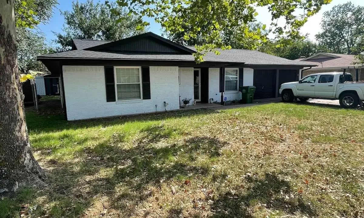 Professional roofing crew working on a residential roof in Spring Lake